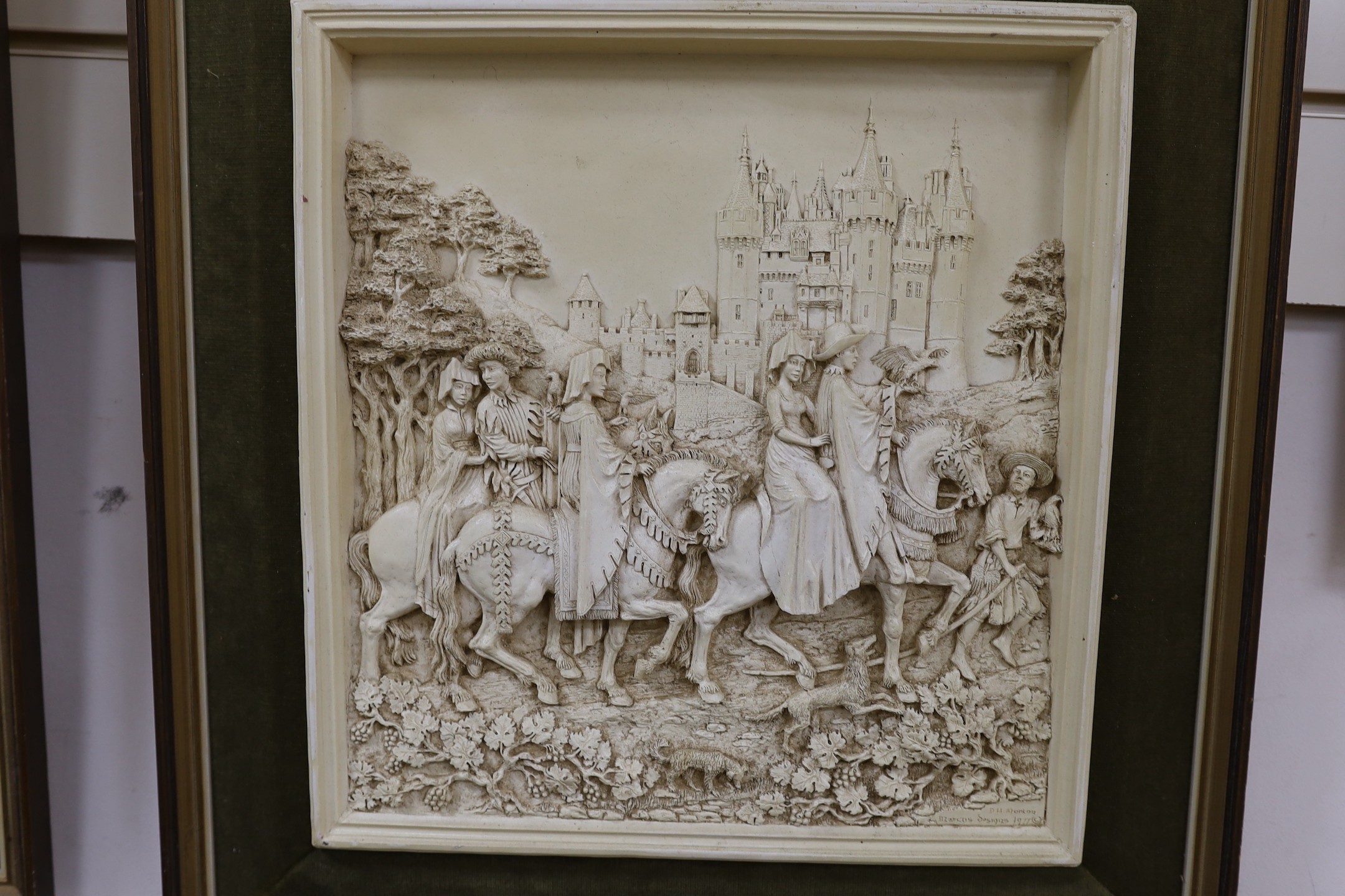 A pair of framed relief plaques